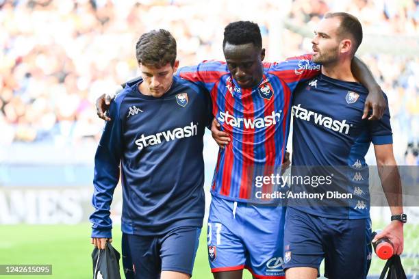 Emmanuel NTIM of Caen leaves the pitch injured during the Ligue 2 BKT match between SM Caen and EA Guingamp at Stade Michel D'Ornano on August 20,...