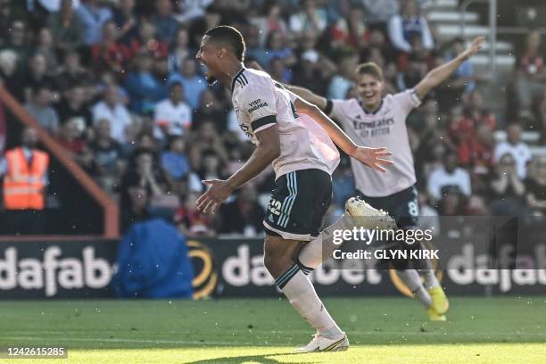 Arsenal's French defender William Saliba celebrates after scoring his team third goal during the English Premier League football match between...