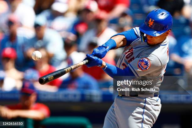 Michael Perez of the New York Mets hits a two-run single against the Philadelphia Phillies during the fifth inning of game one of a doubleheader at...