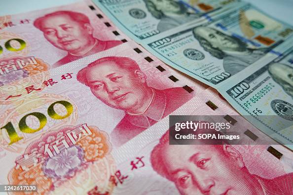 100 Rmb Sign In this photo illustration, 100 US dollar notes and 100 RMB notes ...