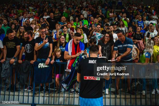 Luka Doncic of Slovenia attends the fans during the basketball friendly match between Slovenia and Croatia in Dvorak Zlatorog hall on August 20, 2022...