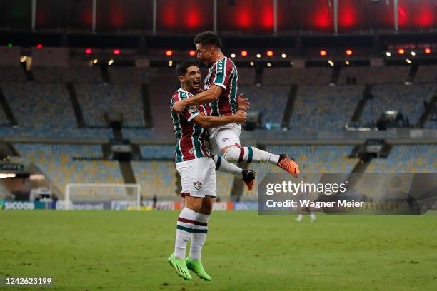 Willian Bigode of Fluminense celebrates after scoring the fifth goal of his team with Michel Araujo during the match between Fluminense and Coritiba...