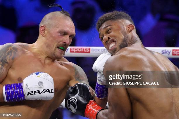 Ukraine's Oleksandr Usyk and Britain's Anthony Joshua compete during the heavyweight boxing rematch for the WBA, WBO, IBO and IBF titles, at the King...