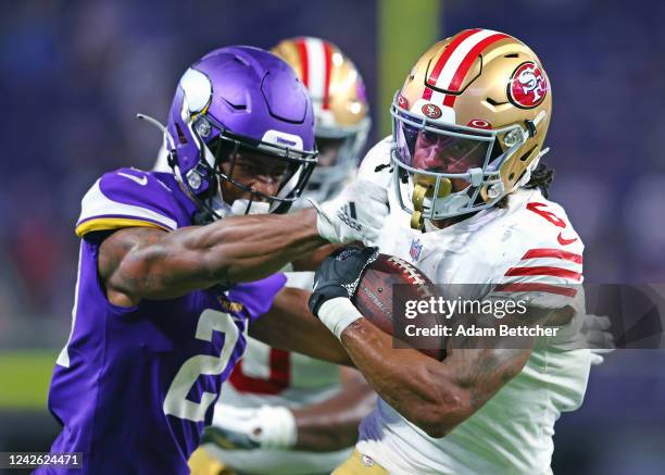 Marcus Johnson of the San Francisco 49ers carries the ball against Nate Hairston of the Minnesota Vikings in preseason play at U.S Bank Stadium on...