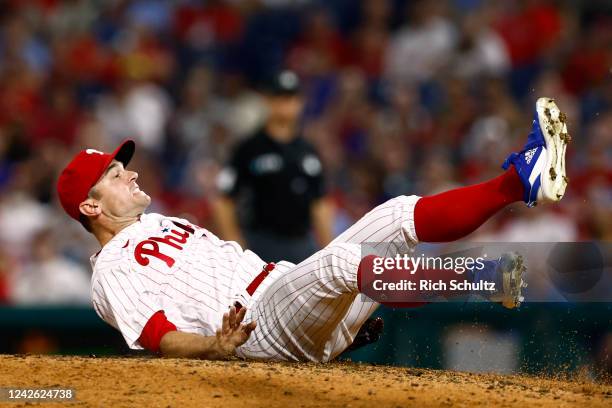 Relief pitcher David Robertson of the Philadelphia Phillies makes a catch and falls backwards the mound on a ball hit by James McCann of the New York...