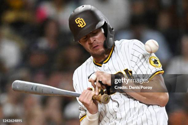 Wil Myers of the San Diego Padres is hit with pitch during the eighth inning of a baseball game against the Washington Nationals August 20, 2022 at...