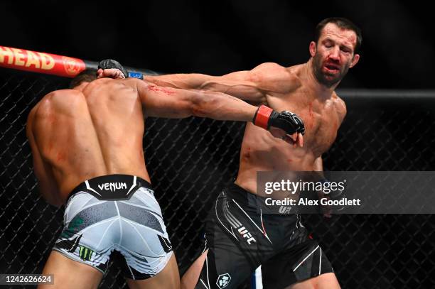 Paulo Costa of Brazil fights Luke Rockhold of the United States in a middleweight bout during UFC 278 at Vivint Arena on August 20, 2022 in Salt Lake...