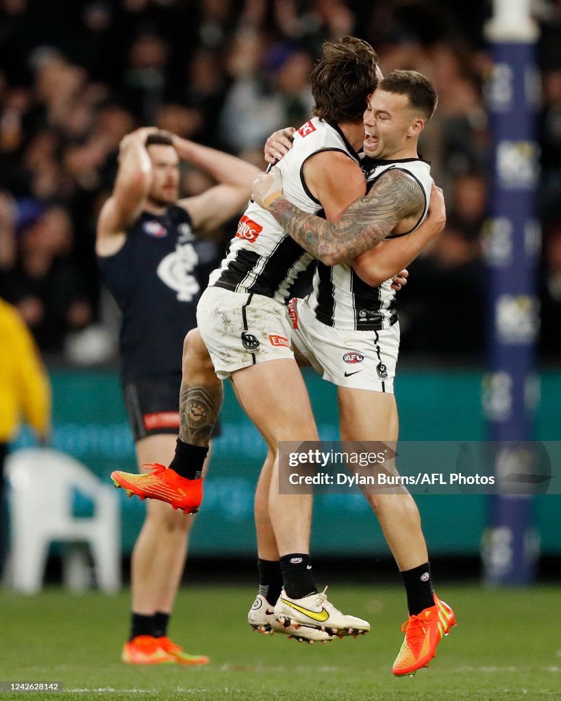 Obbn Patrick Lipinski and Jamie Elliott of the Magpies celebrate after the ...