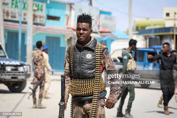 Security officers patrol near the destroyed Hayat Hotel after a deadly 30-hour siege by Al-Shabaab jihadists in Mogadishu on August 21, 2022. - At...