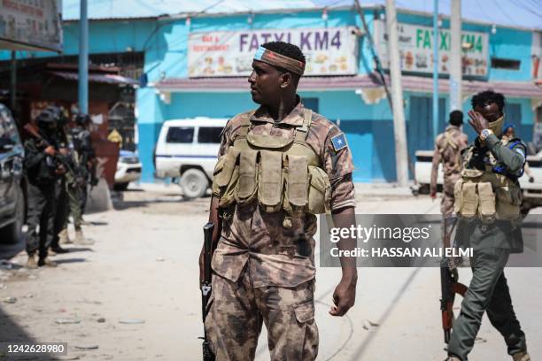 Security officers patrol near the destroyed Hayat Hotel after a deadly 30-hour siege by Al-Shabaab jihadists in Mogadishu on August 21, 2022. - At...