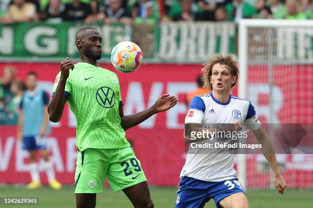 Joshua Guilavogui of VfL Wolfsburg and Alex Kral of FC Schalke 04 battle for the Ball during the Bundesliga match between VfL Wolfsburg and FC...