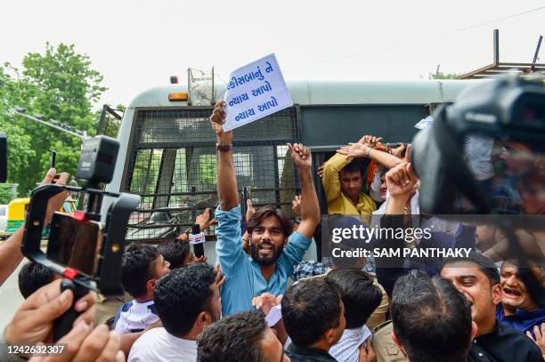Police detain members of Congress Minority Cell during a protest against the release of men convicted of gang-raping Bilkis Bano during the 2002...