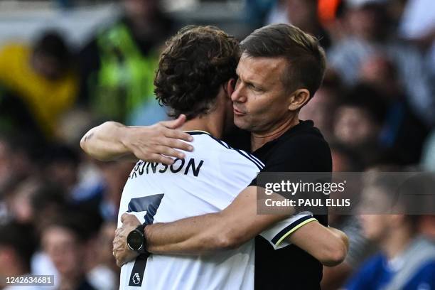 Leeds United's US midfielder Brenden Aaronson is congratulated by Leeds United's US head coach Jesse Marsch as he leaves the pitch during the English...