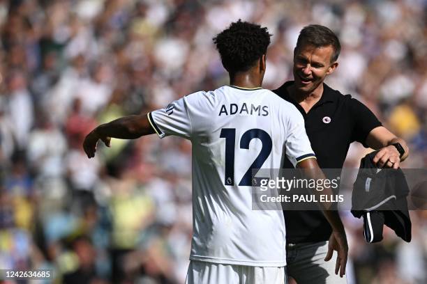 Leeds United's US head coach Jesse Marsch celebrates with Leeds United's US midfielder Tyler Adams after winning at the end of the English Premier...