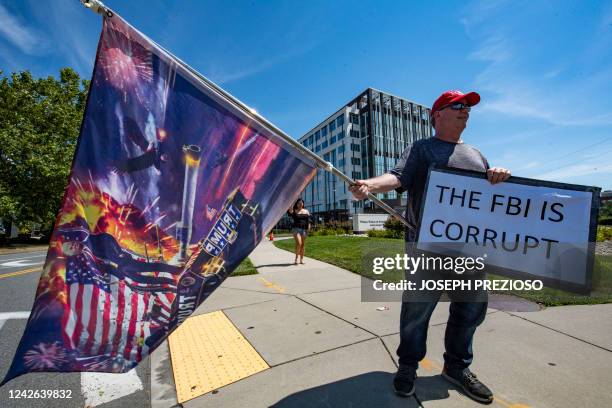 Demonstrators protest the recent actions of the FBI at their Boston headquarters in Chelsea, Massachusetts on August 21, 2022. - The protest is in...