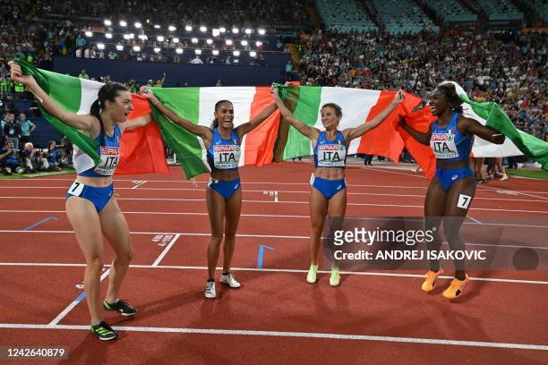 Italy's team celebrates the third place in the women's 4x100m Relay final during the European Athletics Championships at the Olympic Stadium in...