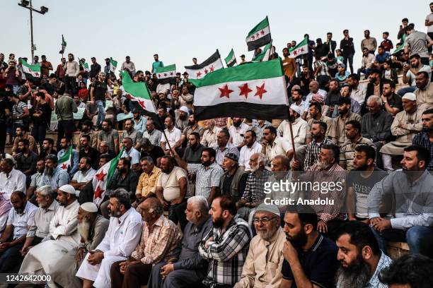 People gather to stage a demonstration against Bashar al-Assad regime's attack on Eastern Ghouta with chemical weapons on Aug. 21 in Idlib, Syria on...