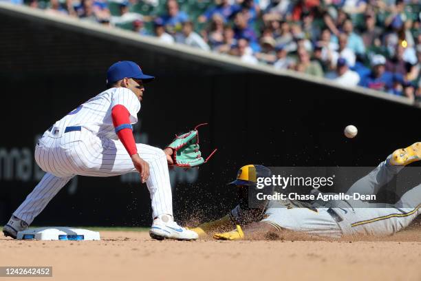 Andrew McCutchen of the Milwaukee Brewers tries to steal second base under the tag of Christopher Morel of the Chicago Cubs in the seventh inning at...