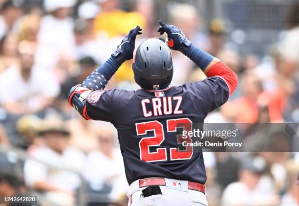 Nelson Cruz of the Washington Nationals points skyward after hitting a solo home run during the fourth inning of a baseball game against the San...