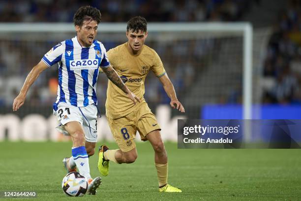 August: David Silva Attacking Midfield of Real Sociedad and Spain and Pedri central midfield of Barcelona and Spain compete for the ball during the...