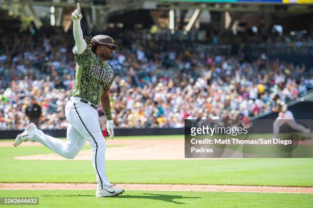 Josh Bell of the San Diego Padres celebrates after hitting a home run in the sixth inning against the Washington Nationals at the PETCO Park on...
