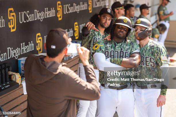 Josh Bell and Brandon Drury of the San Diego Padres celebrate in the dugout after hitting a home run in the sixth inning against the Washington...