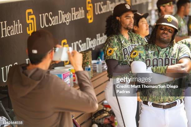 Josh Bell of the San Diego Padres celebrates in the dugout after hitting a home run in the sixth inning against the Washington Nationals at the PETCO...