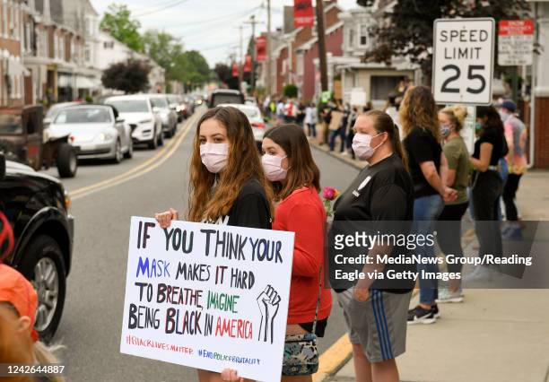 Boyertown, PA People stand along Philadelphia Ave holding signs. During a Boyertown Black Lives Matter Silent Protest held in Boyertown Tuesday night...
