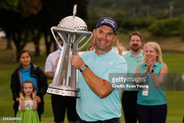 Padraig Harrington of Ireland poses for photographs with the trophy following the final round of the DICK'S Sporting Goods Open at En-Joie Golf Club...