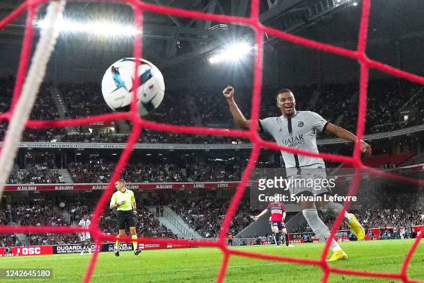 Kylian Mbappe of Paris SG celebrates after scoring his team's 6th goal during the Ligue 1 match between Lille OSC and Paris Saint-Germain at Stade...