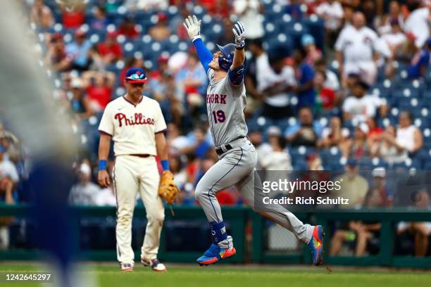Mark Canha of the New York Mets celebrates on the base paths his two-run home run against the Philadelphia Phillies in the ninth inning at Citizens...