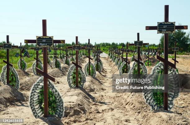 Freshly dug graves for unidentified civilians killed by the Russian military in Bucha massacre in February-March 2022, at the city cemetery, Bucha,...