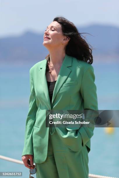 Iris Berben poses for a photo shoot at Martinez Beach on May 19, 2022 in Cannes, France.