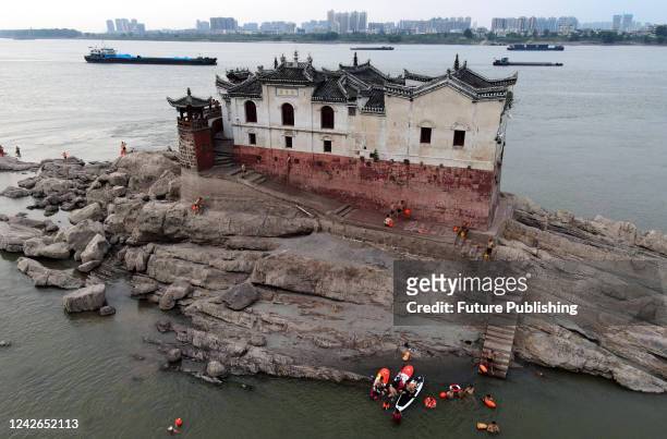 View of the 700-year-old Guanyin Temple, built on a rock in the Yangtze River, in Ezhou city in central China's Hubei province Saturday, Aug. 20,...