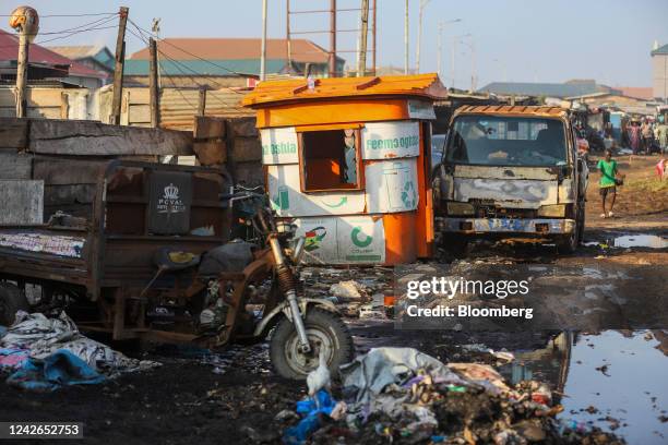 An abandoned recycling kiosk, formerly a site for Ghana Recycling Initiative by Private Enterprises , left, in Accra, Ghana, on Tuesday, July 5,...