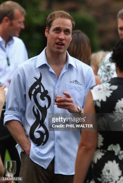 Britain's Prince William talks with guests at Government House on the first day of his visit to Auckland on January 17, 2010. Britain's Prince...