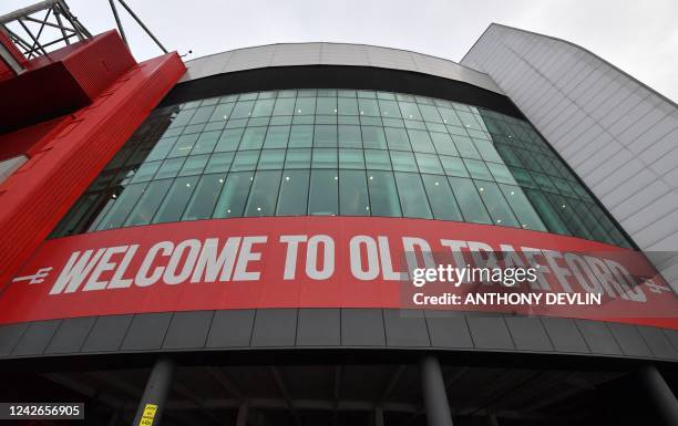 Sign welcomes people to Old Trafford stadium ahead of the English Premier League football match between Manchester United and Liverpool at Old...