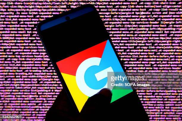 In this photo illustration a Google logo seen displayed on an android smartphone.
