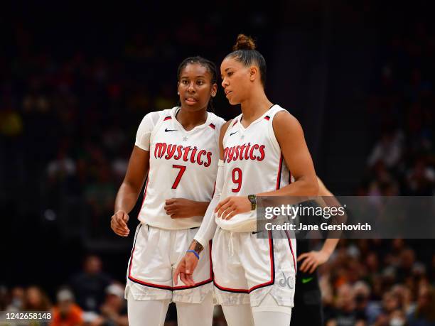 Ariel Atkins and Natasha Cloud of the Washington Mystics converse during the game against the Seattle Storm during Round 1 Game 2 of the 2022 WNBA...