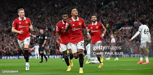 Manchester United's English striker Jadon Sancho celebrates after scoring the opening goal during the English Premier League football match between...