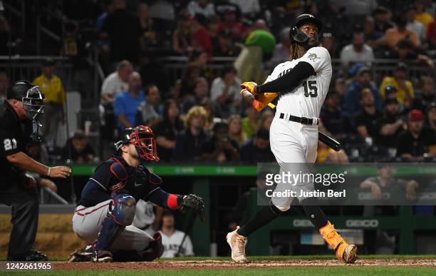 Oneil Cruz of the Pittsburgh Pirates hits a solo home run in the fifth inning during the game against the Atlanta Braves at PNC Park on August 22,...