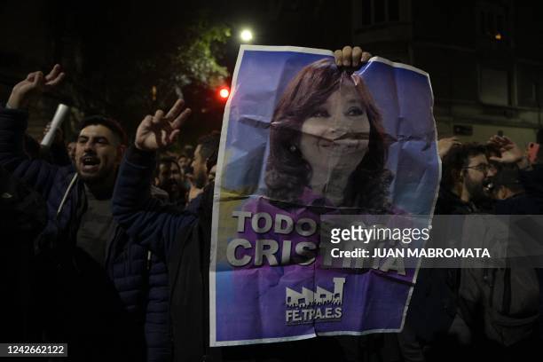 Supporters of Argentina's Vice-President Cristina Fernandez de Kirchner demonstrate outside her apartment in Buenos Aires on August 22 after a public...