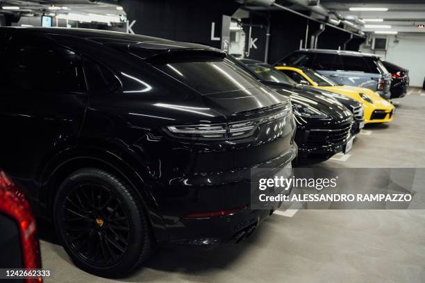 Expensive cars with Russian plate numbers are pictured in the premium parking area of the Helsinki airport on August 19 in Vantaa, Finland. - Luxury...