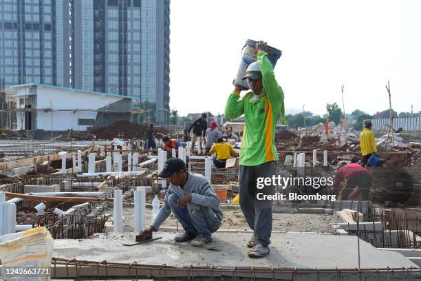 Laborers at a residential development in the Fatmawati area of South Jakarta, Indonesia, on Monday, Aug. 22, 2022. Indonesia is expected to continue...