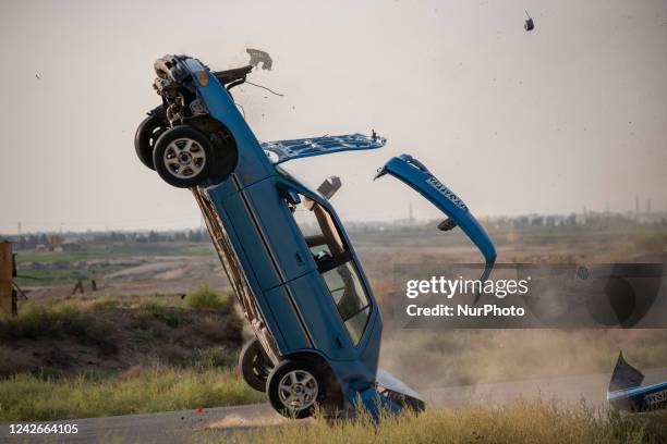 During a test session in the Holy Defense Cinematic Town 25km south of Tehran, an Iranian stuntman Amir Badri throws a Hyundai excel automatic...