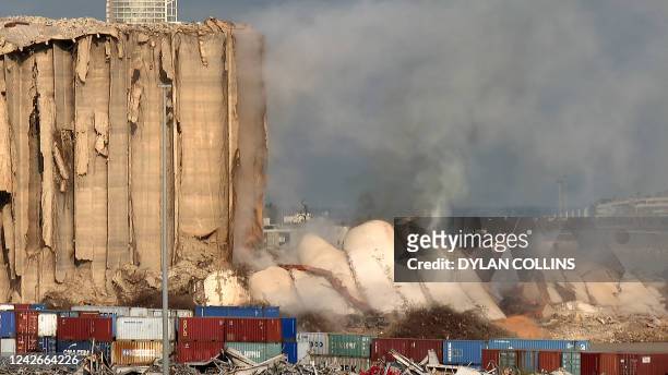 This grab from AFPTV footage shot on August 23, 2022 shows the newly-collapsed northern section of the grain silos at the port of Lebanon's capital...