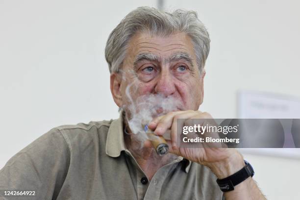 Nick Hayek, chief executive officer of Swatch Group AG, smokes a cigar during an interview at the company's headquarters in Biel, Switzerland, on...