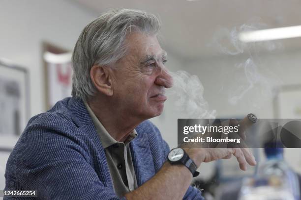 Nick Hayek, chief executive officer of Swatch Group AG, smokes a cigar during an interview at the company's headquarters in Biel, Switzerland, on...
