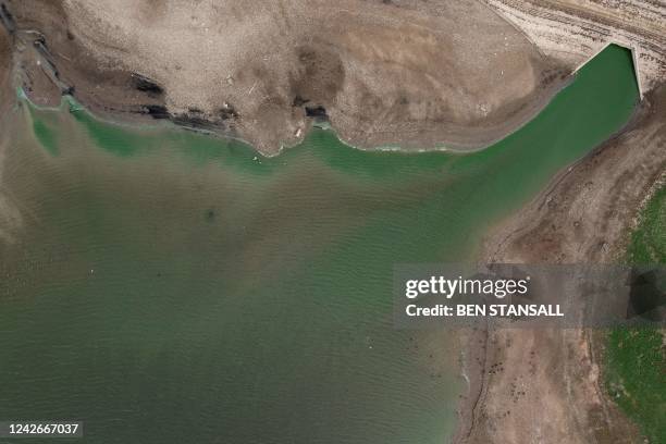 An aerial picture shows low water levels in the Bough Beech Reservoir in Kent on August 23, 2022. - The UK government officially declared a drought...