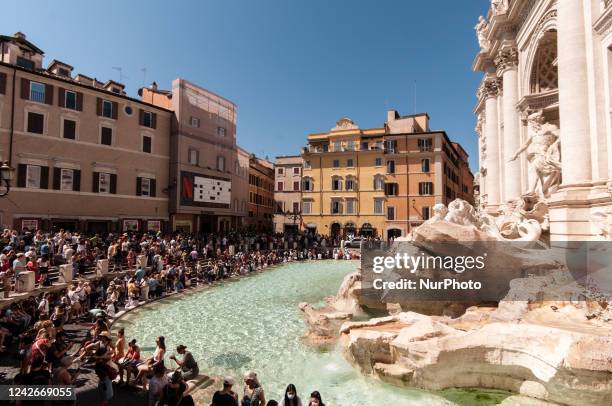 The Trevi Fountain with tourists in Rome, Italy, 23 August 2022.